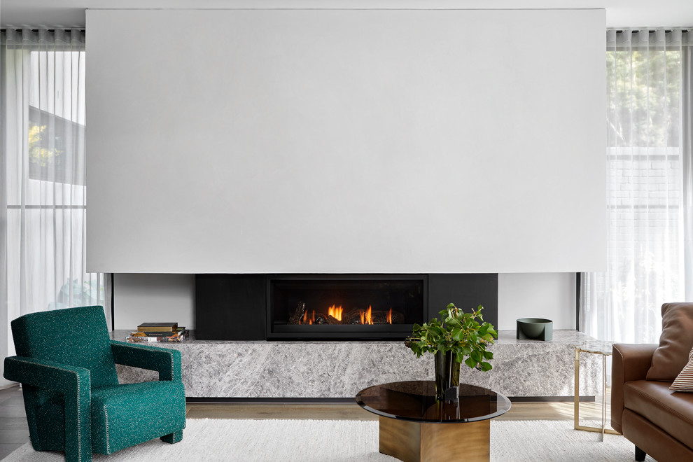 Photo of a medium sized modern open plan living room in Melbourne with a ribbon fireplace, a stone fireplace surround and beige floors.
