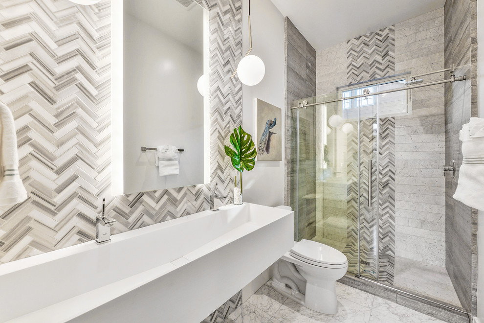 Inspiration for a contemporary 3/4 bathroom in San Francisco with open cabinets, white cabinets, an alcove shower, a two-piece toilet, gray tile, white tile, white walls, an integrated sink, grey floor, a sliding shower screen and white benchtops.