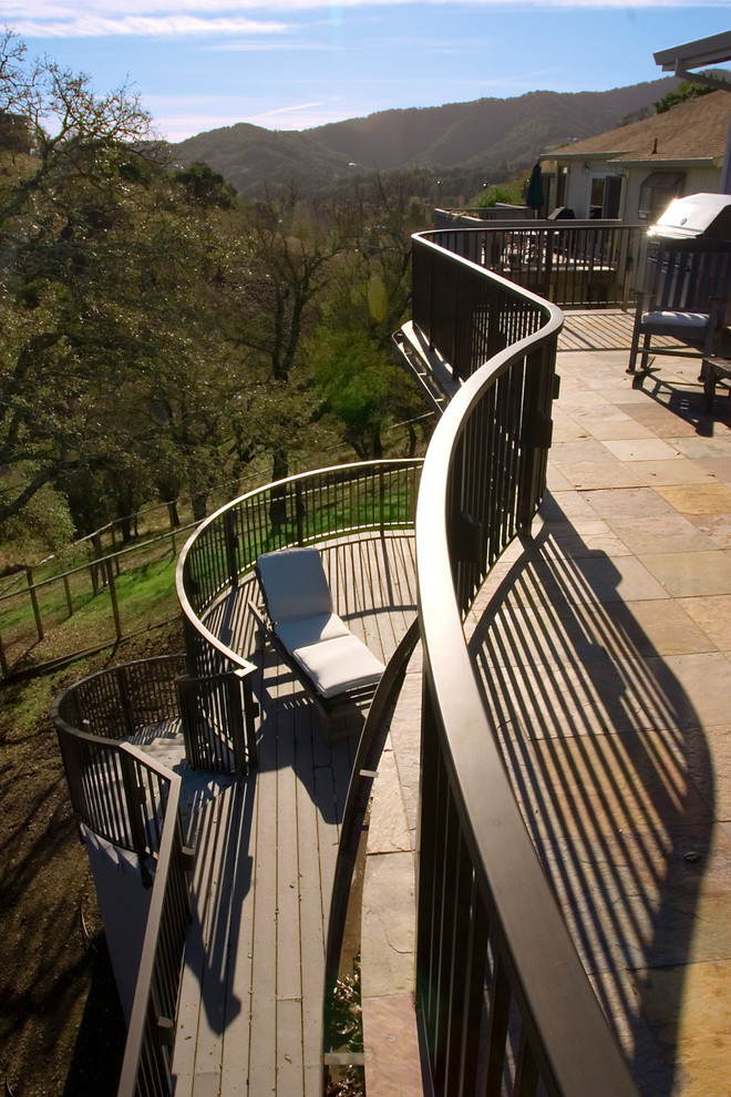 Inspiration for an expansive traditional balcony in San Francisco with a roof extension and metal railing.