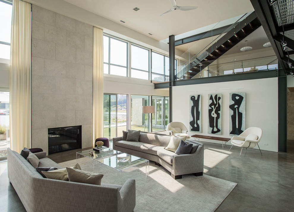 Living room - contemporary formal and open concept concrete floor living room idea in New York with white walls and a standard fireplace