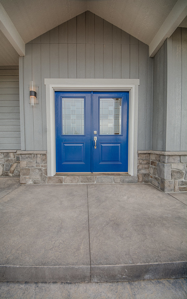 This is an example of a contemporary front door in Denver with a double front door and a blue front door.