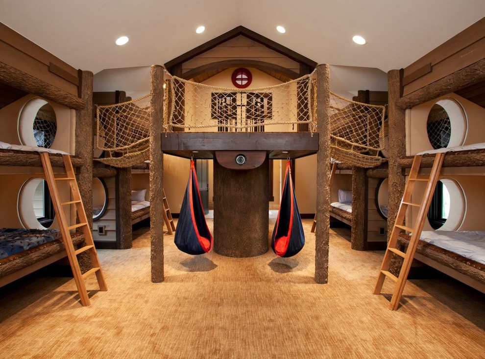 This is an example of a large country gender-neutral kids' bedroom for kids 4-10 years old in Salt Lake City with carpet, beige walls and beige floor.