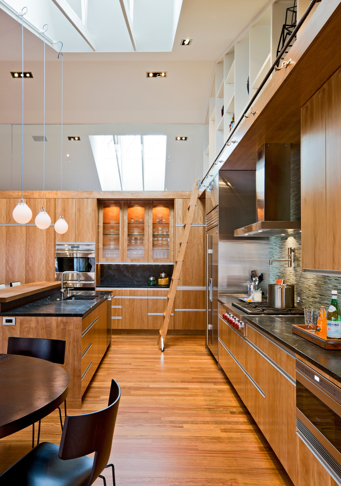 Design ideas for a modern kitchen in Minneapolis with flat-panel cabinets and panelled appliances.