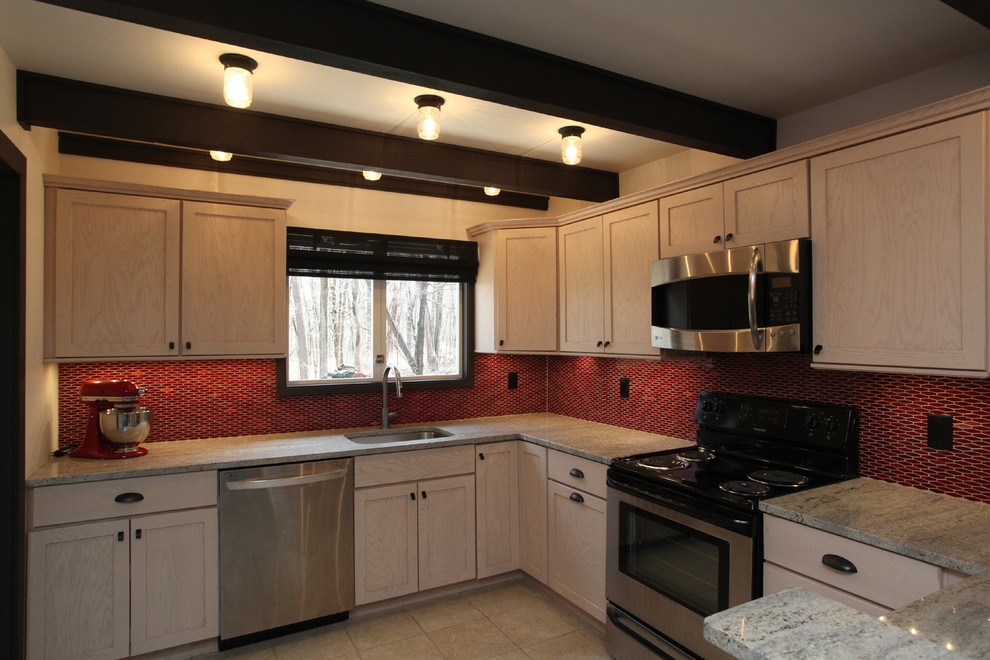 Kitchen - transitional ceramic tile kitchen idea in New York with an undermount sink, shaker cabinets, light wood cabinets, granite countertops, red backsplash, ceramic backsplash and stainless steel appliances