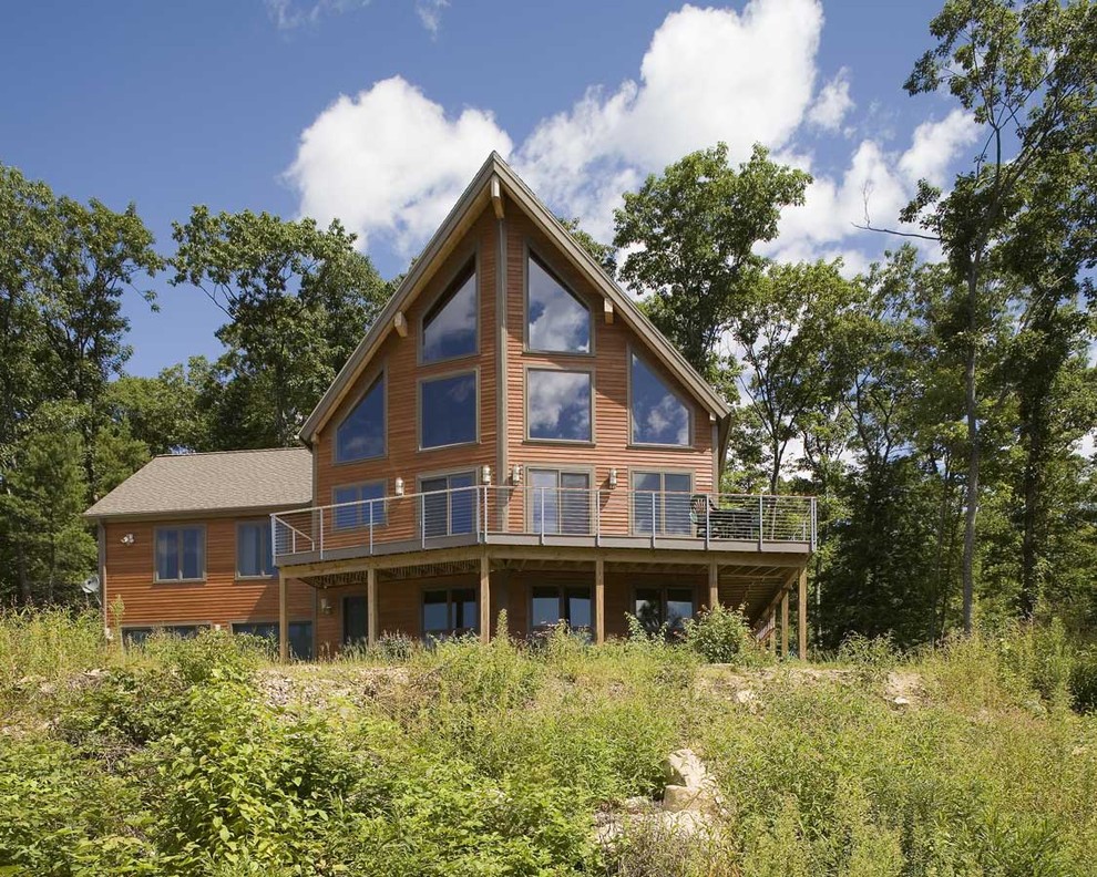 This is an example of a country exterior in Boston with wood siding.