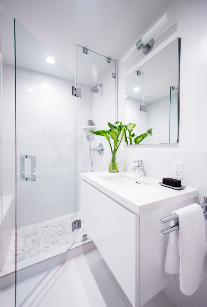 Example of a mid-sized trendy 3/4 white tile and porcelain tile porcelain tile bathroom design in Los Angeles with an undermount sink, flat-panel cabinets, white cabinets, quartz countertops, a one-piece toilet and white walls