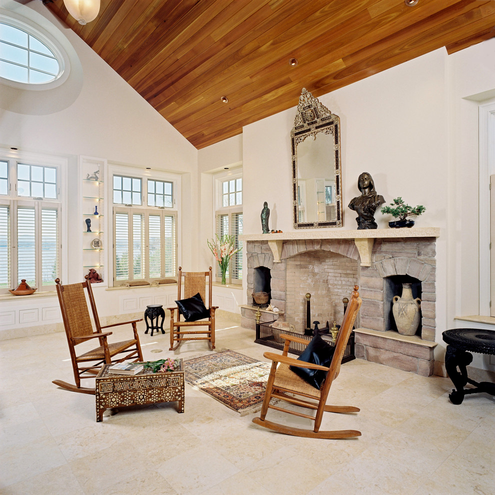 Design ideas for a traditional living room in Burlington with white walls and a standard fireplace.