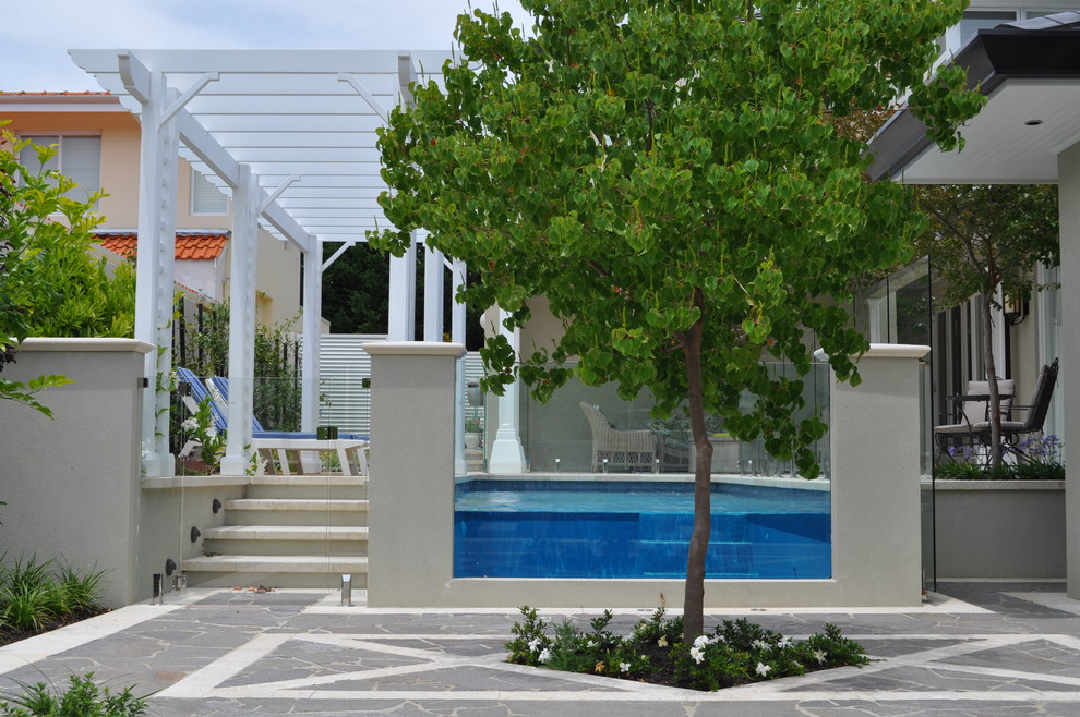 Inspiration for a mid-sized contemporary backyard garden for summer in Perth.