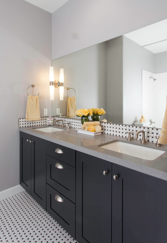 Inspiration for a mid-sized transitional master bathroom in San Diego with shaker cabinets, grey cabinets, a freestanding tub, a shower/bathtub combo, black and white tile, marble, quartzite benchtops, a shower curtain and grey benchtops.