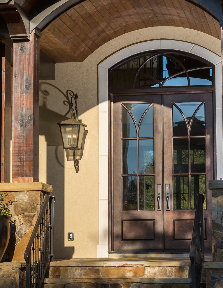 Design ideas for a large traditional front door in Charlotte with a double front door and a brown front door.