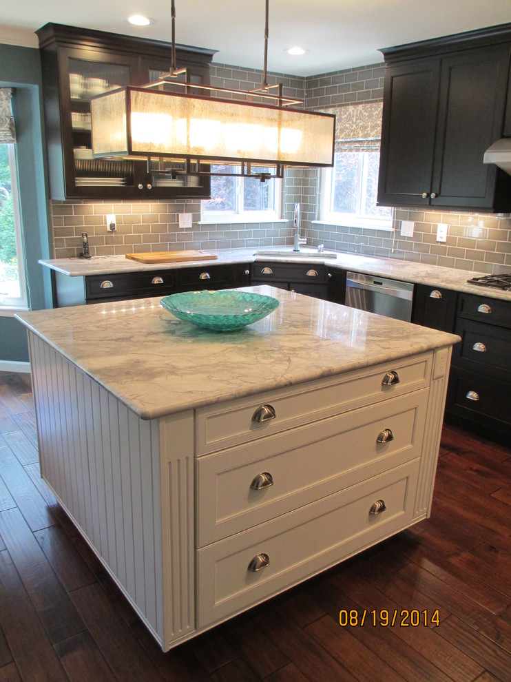 Example of a mid-sized transitional u-shaped dark wood floor kitchen design in Denver with an undermount sink, shaker cabinets, dark wood cabinets, marble countertops, gray backsplash, subway tile backsplash, stainless steel appliances and an island
