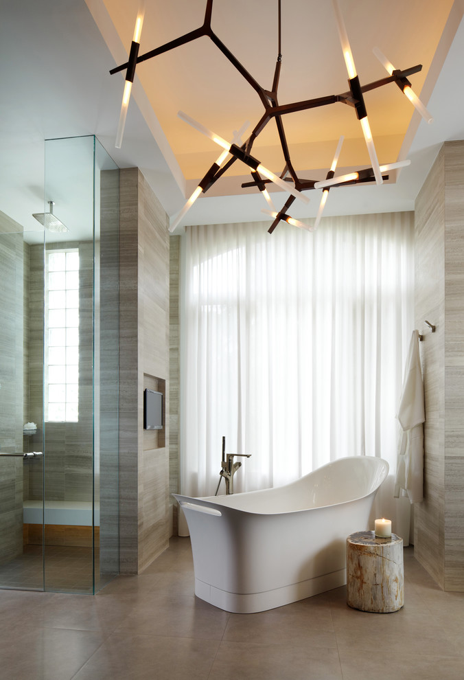 Inspiration for a contemporary bathroom in Miami with a freestanding tub.