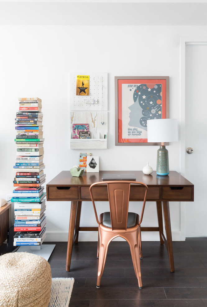 Inspiration for a mid-sized midcentury home office in New York with white walls, dark hardwood floors and a freestanding desk.
