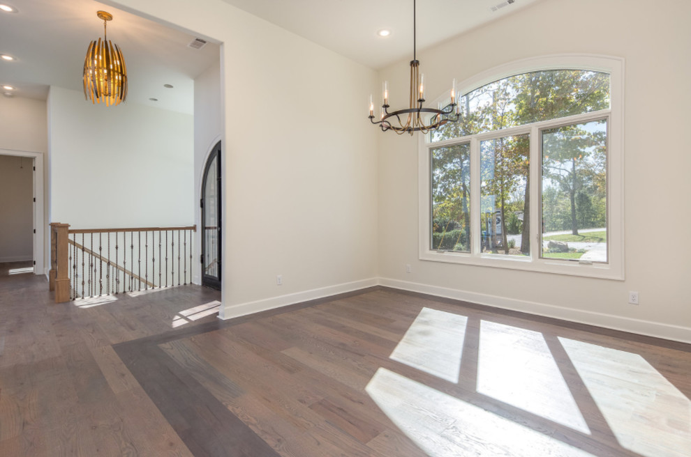 Inspiration for a large transitional dark wood floor and brown floor front door remodel with white walls and a glass front door