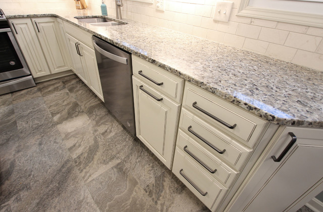 Beige Kitchen With Extra Large Island Tile Backsplash And Granite