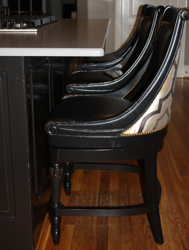 Inspiration for a large transitional u-shaped light wood floor eat-in kitchen remodel with a double-bowl sink, raised-panel cabinets, gray cabinets, quartz countertops, beige backsplash, ceramic backsplash, stainless steel appliances and an island