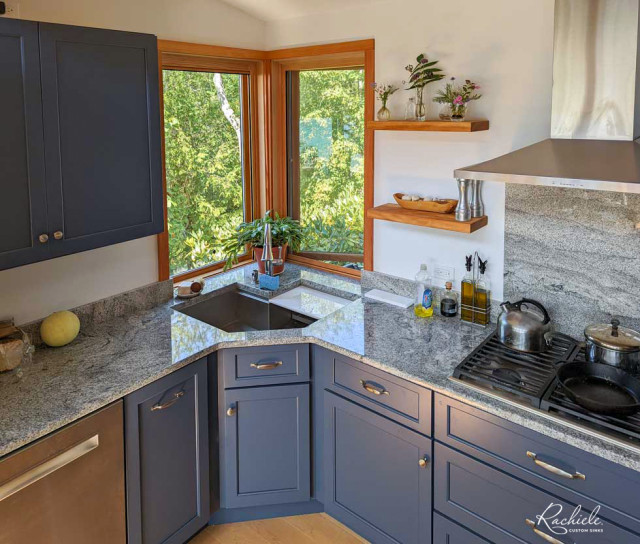 Custom Stainless Corner Workstation Sink in a Blue Kitchen