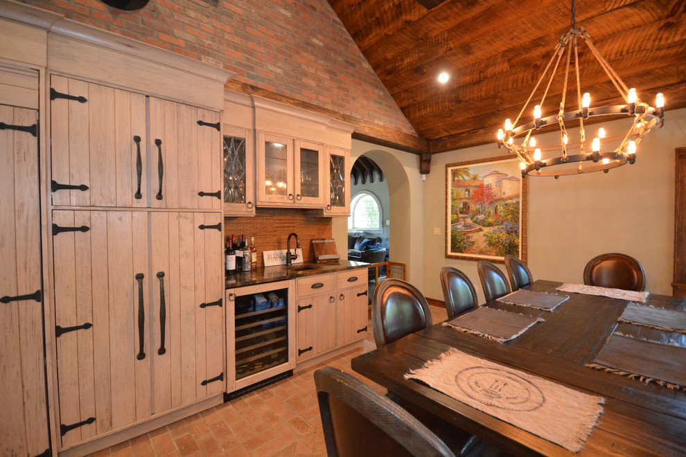 Large mountain style brick floor eat-in kitchen photo in New York with a farmhouse sink, beige cabinets, quartzite countertops and limestone backsplash