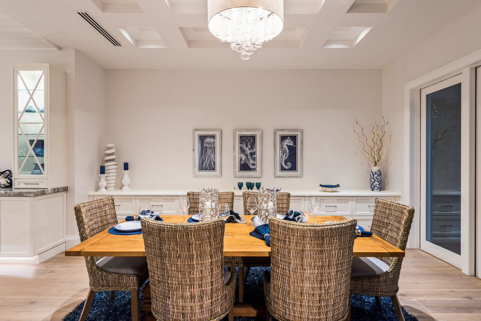 Mid-sized transitional medium tone wood floor and brown floor kitchen/dining room combo photo with white walls