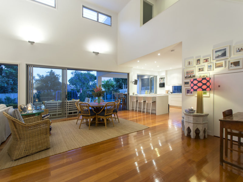 This is an example of a large contemporary living room in Brisbane.