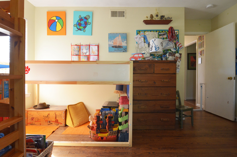 Photo of a beach style kids' room for boys in Dallas with yellow walls.