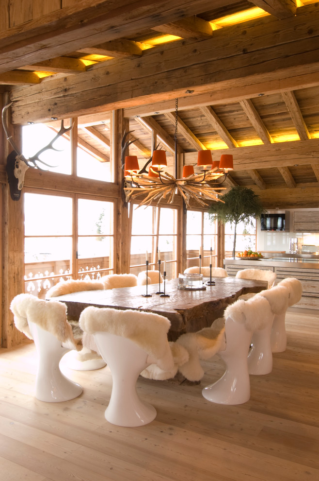 Inspiration for a country open plan dining in Other with light hardwood floors.