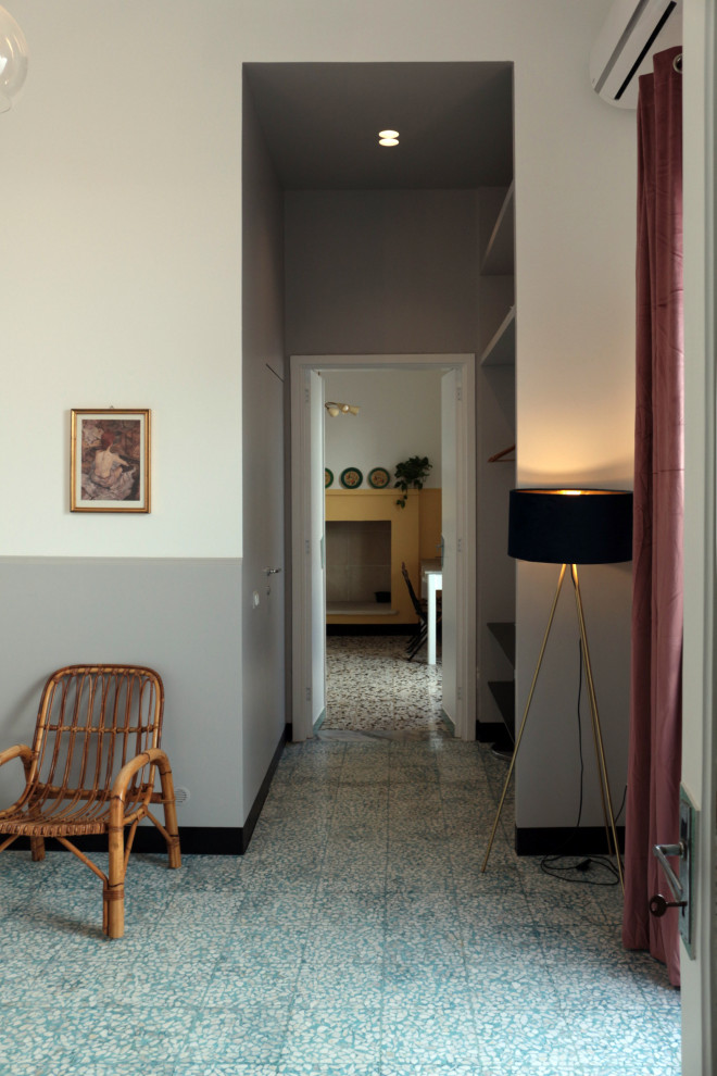This is an example of an eclectic entryway in Other with grey walls, blue floor and recessed.