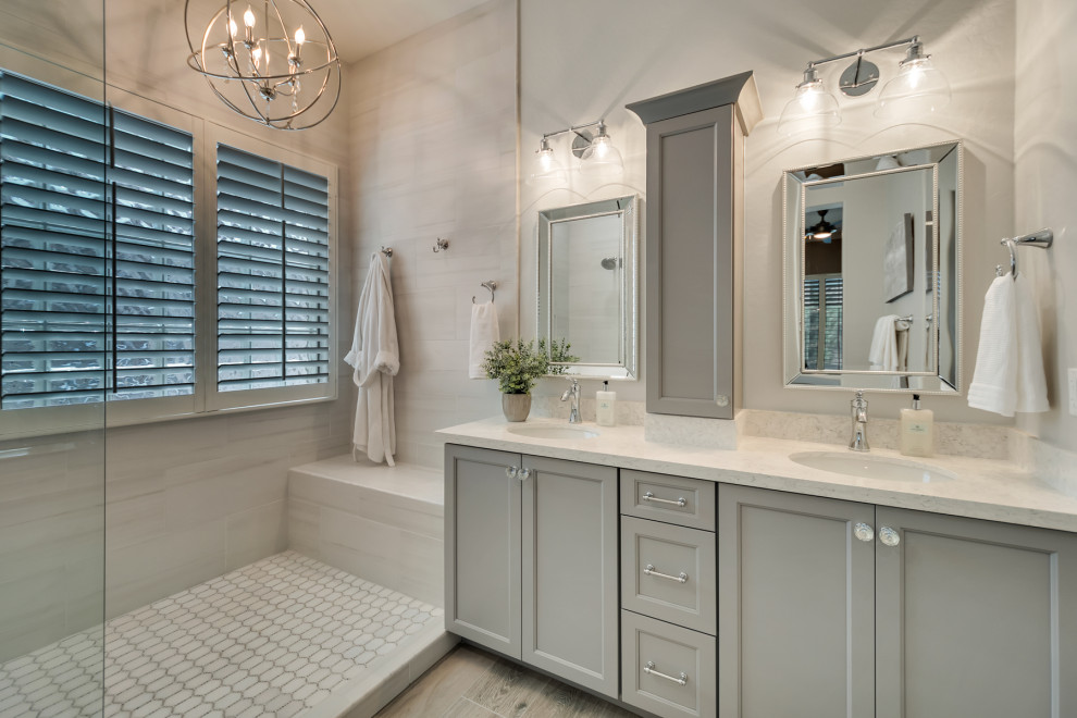 Inspiration for a mid-sized transitional master bathroom in Phoenix with shaker cabinets, grey cabinets, an open shower, white tile, porcelain tile, grey walls, wood-look tile, an undermount sink, granite benchtops, multi-coloured floor, white benchtops, a niche and a double vanity.