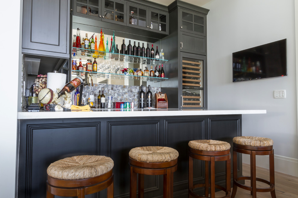 This is an example of a large modern home bar in Miami.