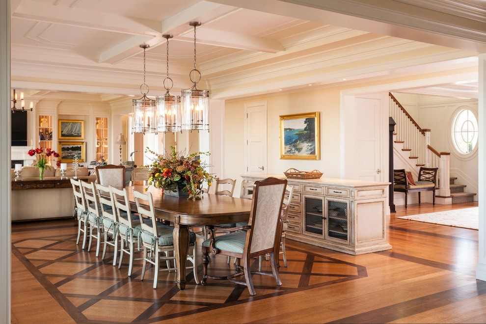 This is an example of a large beach style open plan dining in Boston with beige walls, medium hardwood floors and no fireplace.