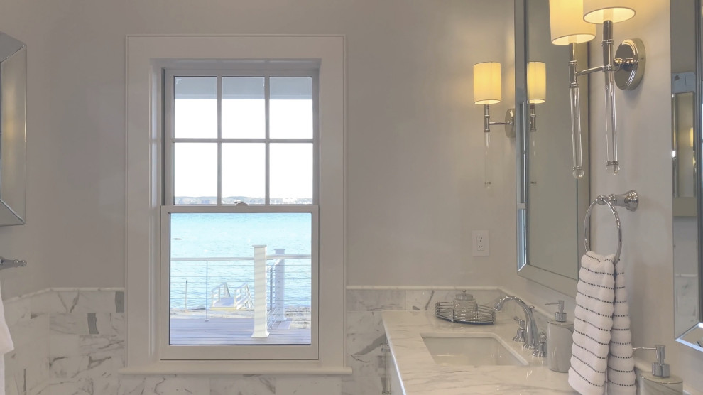 Open shower - mid-sized transitional master yellow tile and marble tile marble floor, gray floor and double-sink open shower idea in Boston with recessed-panel cabinets, white cabinets, a one-piece toilet, white walls, an undermount sink, marble countertops, gray countertops and a built-in vanity