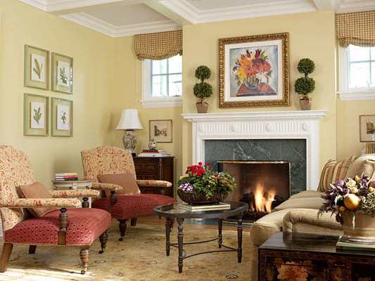 This is an example of a large traditional formal enclosed living room in Chicago with yellow walls, light hardwood floors, a standard fireplace, a tile fireplace surround and no tv.