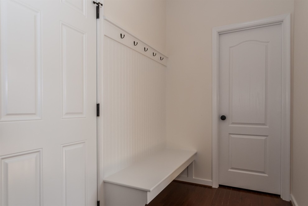 Small transitional mudroom in Richmond with beige walls and medium hardwood floors.
