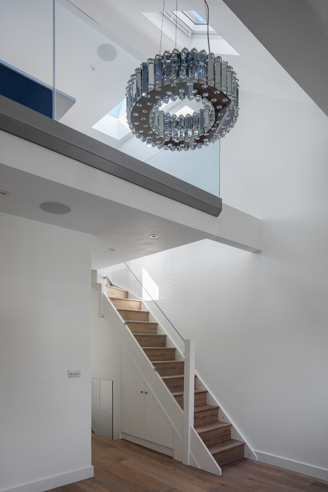 Photo of a medium sized contemporary formal mezzanine living room in London with light hardwood flooring.