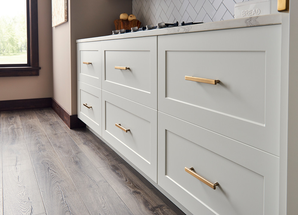 Example of a transitional kitchen design in Minneapolis with flat-panel cabinets and gray cabinets
