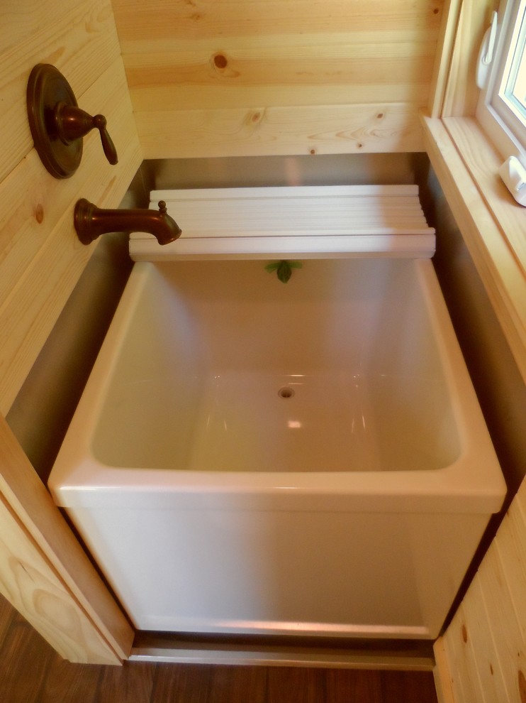 This is an example of a small asian 3/4 bathroom in Portland with a japanese tub and dark hardwood floors.