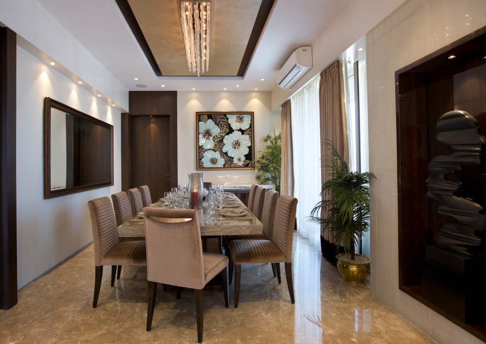 Design ideas for a contemporary dining room in Mumbai.