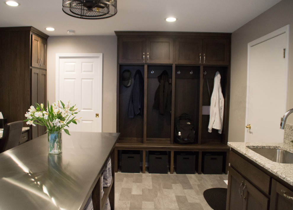 Inspiration for a transitional gray floor utility room remodel with an utility sink, recessed-panel cabinets, granite countertops, gray walls and a side-by-side washer/dryer