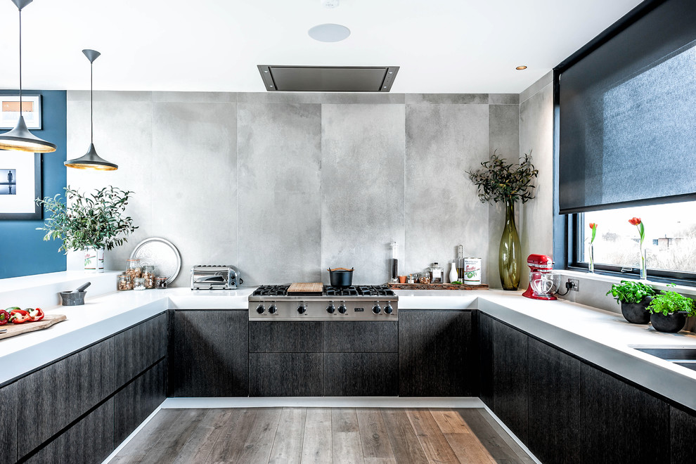Inspiration for a contemporary open plan kitchen in Other with a double-bowl sink, flat-panel cabinets, dark wood cabinets, ceramic splashback, stainless steel appliances, dark hardwood floors and white benchtop.