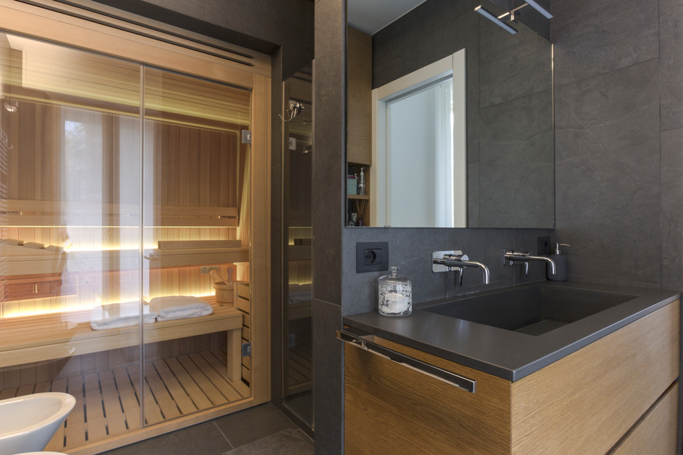 Inspiration for a contemporary bathroom in Milan with with a sauna and a vessel sink.