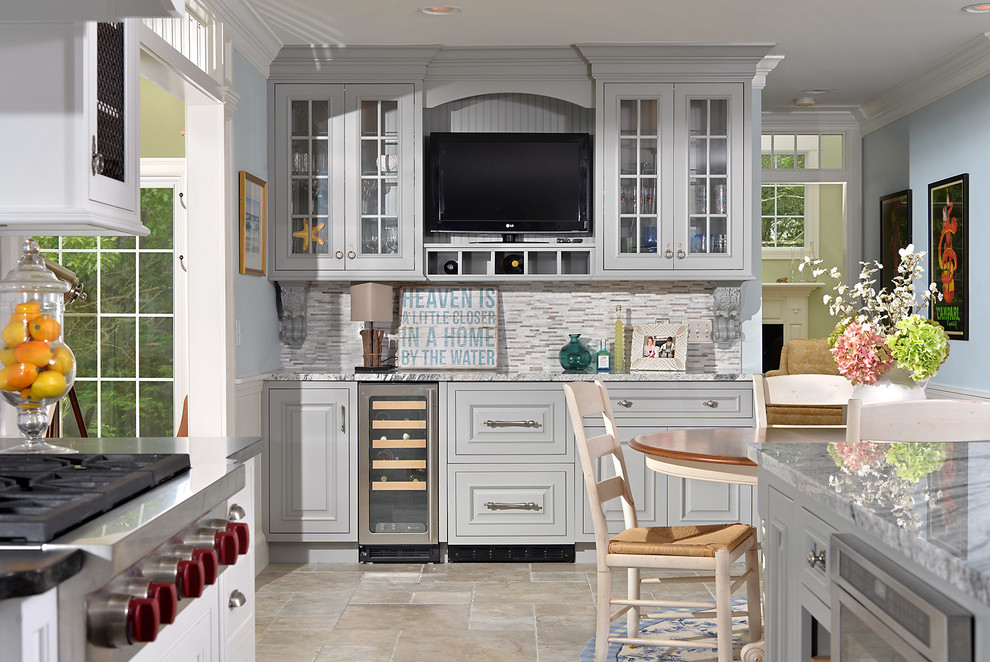 Example of a large transitional ceramic tile eat-in kitchen design in Atlanta with glass-front cabinets, gray cabinets, granite countertops, gray backsplash, glass tile backsplash, stainless steel appliances, blue walls and an island