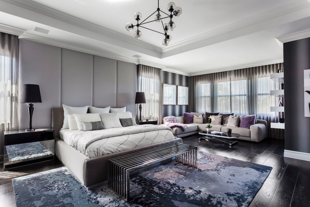Contemporary master bedroom in Miami with purple walls, dark hardwood floors and brown floor.