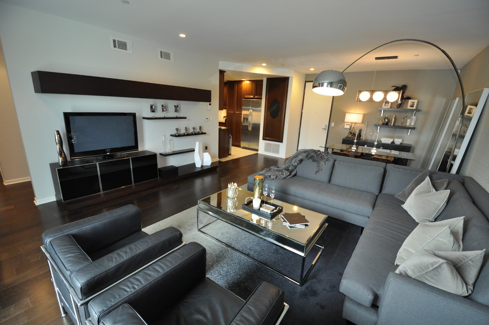 Inspiration for a mid-sized contemporary open concept medium tone wood floor living room remodel in Los Angeles with a corner fireplace and a tv stand