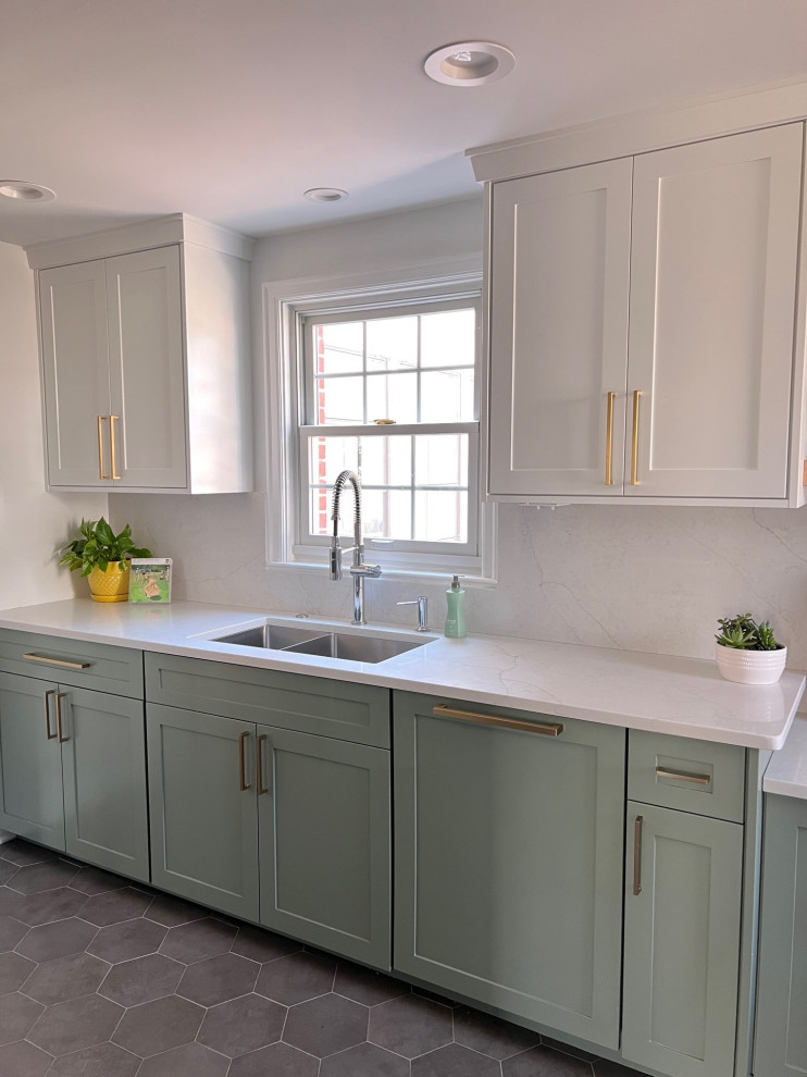 Photo of a small classic galley enclosed kitchen in Indianapolis with a submerged sink, shaker cabinets, green cabinets, engineered stone countertops, white splashback, engineered quartz splashback, stainless steel appliances, porcelain flooring, no island, grey floors and yellow worktops.