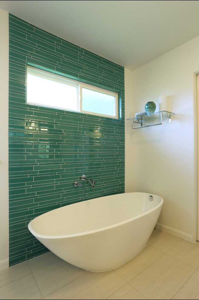 Mid-sized midcentury master bathroom in Portland with furniture-like cabinets, dark wood cabinets, a freestanding tub, blue tile, glass tile, white walls, ceramic floors and engineered quartz benchtops.