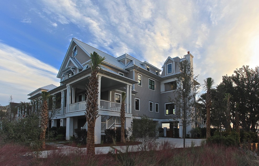 This is an example of a large beach style three-storey exterior in Charleston.