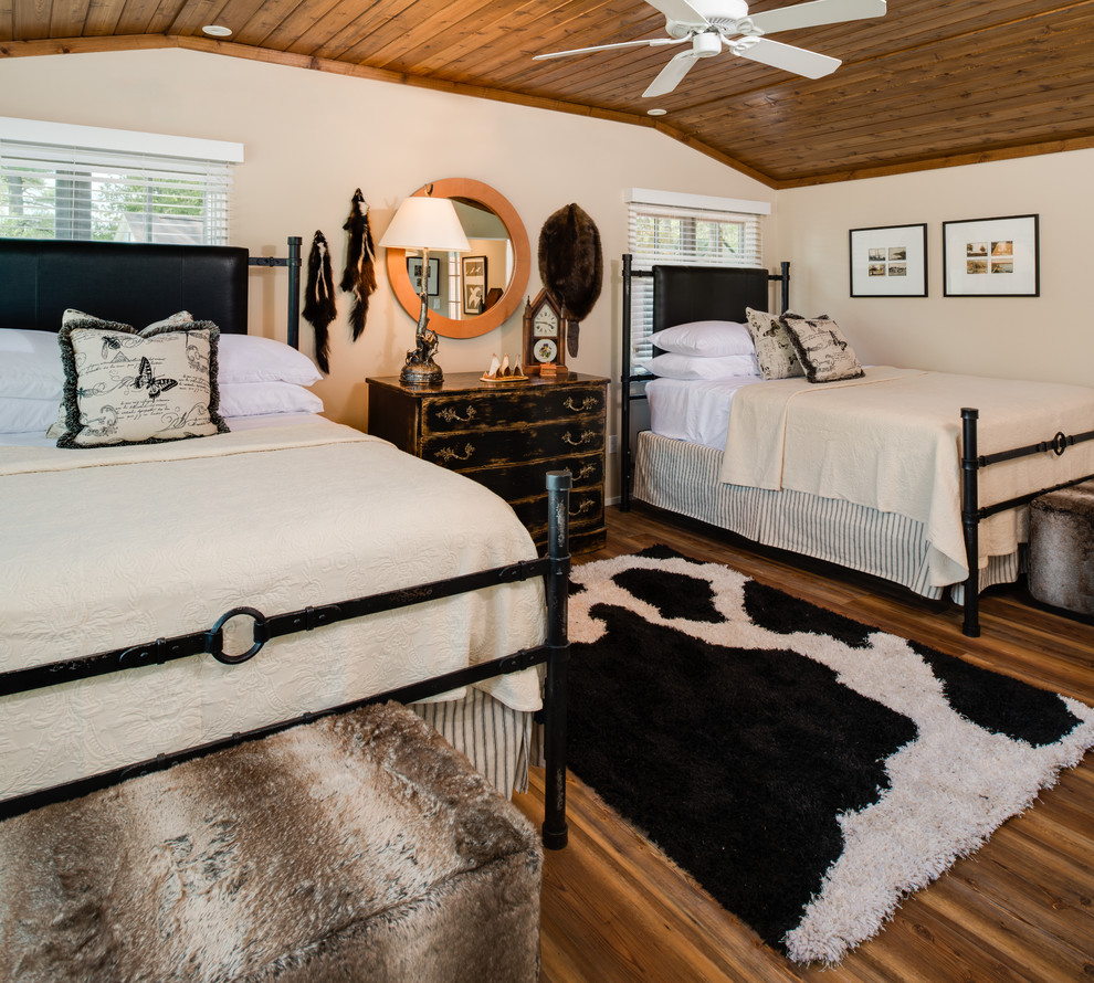 Inspiration for a country guest bedroom in Other with beige walls, dark hardwood floors and brown floor.