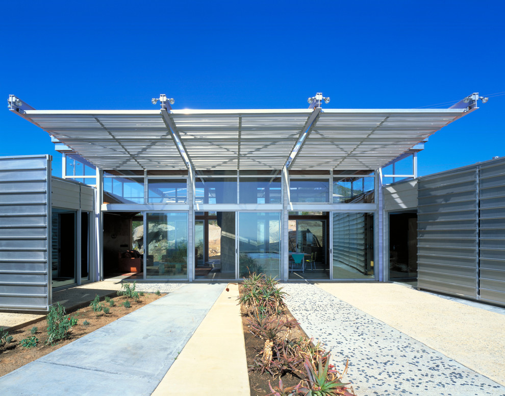 Photo of an industrial one-storey house exterior in Other with metal siding.