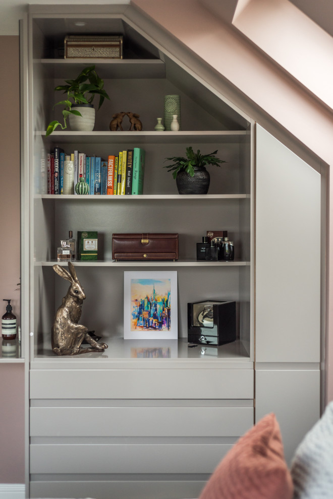 Inspiration for a large modern built-in wardrobe in Edinburgh with flat-panel cabinets, grey cabinets, carpet, grey floors, a drop ceiling and feature lighting.