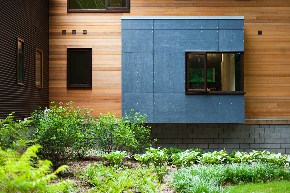 Design ideas for a contemporary exterior in Grand Rapids with wood siding.